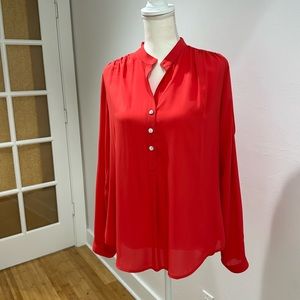 Bright coral colored blouse